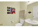 Charming powder room featuring an undermount sink, mirror, and colorful decor at 5861 W Deerview Bnd, McCordsville, IN 46055