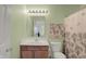 Bathroom with a vanity, sink, toilet, and shower/bath with light green walls at 5861 W Deerview Bnd, McCordsville, IN 46055