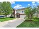 Exterior showcasing a two-story home with an attached two-car garage, lawn, and concrete driveway at 5861 W Deerview Bnd, McCordsville, IN 46055