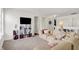 Cozy living room with TV, sofa, and decorative shelving units, creating a comfortable and inviting space at 5861 W Deerview Bnd, McCordsville, IN 46055