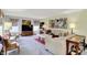 Spacious living room with a large TV, lots of seating, and neutral decor at 5861 W Deerview Bnd, McCordsville, IN 46055