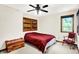 Bedroom featuring a wood-framed window, ceiling fan, and a wood chest at 5861 W Deerview Bnd, McCordsville, IN 46055