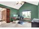 Home office featuring green walls, a ceiling fan, and a window at 5861 W Deerview Bnd, McCordsville, IN 46055