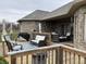 Relax on this home's wooden deck with comfortable furniture, creating an ideal outdoor living space at 6089 W Hellis Dr, Muncie, IN 47304