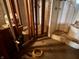 Image of partially finished bathroom with shower and plumbing in basement at 6089 W Hellis Dr, Muncie, IN 47304