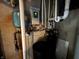 Image shows the home's water filtration system and related utilities in the basement at 6089 W Hellis Dr, Muncie, IN 47304