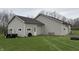 Spacious two-car garage with vinyl siding offers ample storage space with convenient access and functionality at 6089 W Hellis Dr, Muncie, IN 47304
