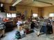 Garage includes work benches, tool chests, and windows for natural light at 6089 W Hellis Dr, Muncie, IN 47304