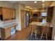 Functional kitchen features ample cabinet storage and granite countertops at 6089 W Hellis Dr, Muncie, IN 47304