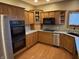 Bright kitchen with ample counter space and stainless steel appliances at 6089 W Hellis Dr, Muncie, IN 47304