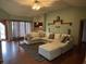 Spacious living room featuring a comfortable sectional sofa and large windows at 6089 W Hellis Dr, Muncie, IN 47304