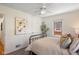 Comfortable bedroom featuring carpet floors, neutral walls, a ceiling fan, and great natural light at 6120 Norwaldo Ave, Indianapolis, IN 46220