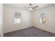 Bright bedroom with carpet floors, two windows, neutral walls, and natural light at 6120 Norwaldo Ave, Indianapolis, IN 46220