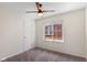 Cozy bedroom featuring neutral walls, carpet floors, a ceiling fan, and bright natural light at 6120 Norwaldo Ave, Indianapolis, IN 46220