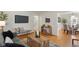 Open concept living room featuring hardwood floors and seamless flow into dining area at 6120 Norwaldo Ave, Indianapolis, IN 46220
