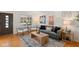 Inviting living room with hardwood floors, neutral decor and ample natural light at 6120 Norwaldo Ave, Indianapolis, IN 46220