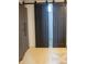 Basement storage with dark sliding barn doors and bonus matching wardrobe at 619 Kessler Blvd E Dr, Indianapolis, IN 46220