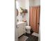 Updated bathroom featuring hexagon tile floors and warm toned shower curtain at 619 Kessler Blvd E Dr, Indianapolis, IN 46220