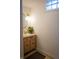 Powder room featuring custom vanity with light fixture and round mirror at 619 Kessler Blvd E Dr, Indianapolis, IN 46220