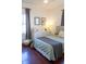 Comfortable bedroom featuring neutral tones and natural light from two windows at 619 Kessler Blvd E Dr, Indianapolis, IN 46220