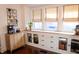 Bright dining area featuring built-in cabinets and natural light from large windows at 619 Kessler Blvd E Dr, Indianapolis, IN 46220