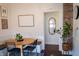 Inviting dining area featuring a wooden table, brick accent wall, and comfortable seating at 619 Kessler Blvd E Dr, Indianapolis, IN 46220