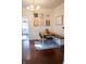 Charming dining area with unique light fixture, a modern table, chairs, and bench seating at 619 Kessler Blvd E Dr, Indianapolis, IN 46220