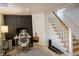 Home office with black accent wall, work station, and workout equipment at 619 Kessler Blvd E Dr, Indianapolis, IN 46220