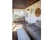 Cozy sunroom featuring neutral furniture, natural light, and string lights for a relaxing ambiance at 619 Kessler Blvd E Dr, Indianapolis, IN 46220