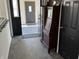 Inviting entryway featuring tiled floors, a vintage secretary, and neutral wall colors that offer a clean, modern aesthetic at 6431 W 800 S, Pendleton, IN 46064