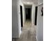 Clean hallway featuring neutral wall colors and wood-look flooring, offering a modern aesthetic at 6431 W 800 S, Pendleton, IN 46064