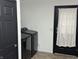 Functional laundry area with modern washer and dryer, plus a convenient door with curtain at 6431 W 800 S, Pendleton, IN 46064