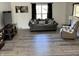 Cozy living room featuring a plush sofa, recliner, and a TV, perfect for relaxing and entertaining at 6431 W 800 S, Pendleton, IN 46064