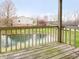 Balcony view overlooking a serene pond and lush green space, perfect for relaxation and enjoying nature at 7220 Village Parkway Dr # 8, Indianapolis, IN 46254