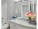 Bathroom with a marble vanity, decorative accents, and well-lit mirror at 7220 Village Parkway Dr # 8, Indianapolis, IN 46254
