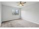 Bright bedroom with a ceiling fan, natural light and a large window at 7220 Village Parkway Dr # 8, Indianapolis, IN 46254
