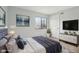 Well-staged bedroom featuring neutral colors, a large window, and modern furnishings at 7220 Village Parkway Dr # 8, Indianapolis, IN 46254
