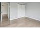 Spacious bedroom with light wood floors and a large closet at 7220 Village Parkway Dr # 8, Indianapolis, IN 46254