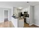 Bright kitchen with white cabinets, modern appliances, bar seating, and contemporary backsplash at 7220 Village Parkway Dr # 8, Indianapolis, IN 46254