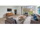 Cozy living room showcasing contemporary furnishings and a sliding glass door with balcony access at 7220 Village Parkway Dr # 8, Indianapolis, IN 46254