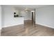 Spacious living area with a partial kitchen view, showcasing modern flooring and neutral wall colors at 7220 Village Parkway Dr # 8, Indianapolis, IN 46254
