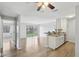 Bright, open living space boasts sleek flooring, a modern kitchen, and sliding glass doors with a view to outside at 7220 Village Parkway Dr # 8, Indianapolis, IN 46254