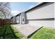 Concrete patio and a fenced in backyard featuring maintained lawn, wooden fence, and the side of the house at 726 Westridge S Dr, Noblesville, IN 46062