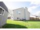 Wide shot of the backyard showing the fenced in area and the exterior of the home and shed at 726 Westridge S Dr, Noblesville, IN 46062