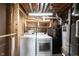 Basement laundry area featuring a new washer and dryer and an organized shelving unit at 726 Westridge S Dr, Noblesville, IN 46062