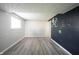 This finished basement has luxury vinyl plank flooring and a painted accent wall at 726 Westridge S Dr, Noblesville, IN 46062