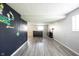 This finished basement has luxury vinyl plank flooring and a bar at 726 Westridge S Dr, Noblesville, IN 46062