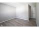 This bedroom has neutral paint, new luxury vinyl plank flooring, and a closet at 726 Westridge S Dr, Noblesville, IN 46062