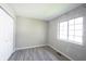 This bedroom has neutral paint, new luxury vinyl plank flooring, and a window for lots of natural light at 726 Westridge S Dr, Noblesville, IN 46062