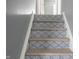 Unique staircase with patterned risers and wood treads at 726 Westridge S Dr, Noblesville, IN 46062